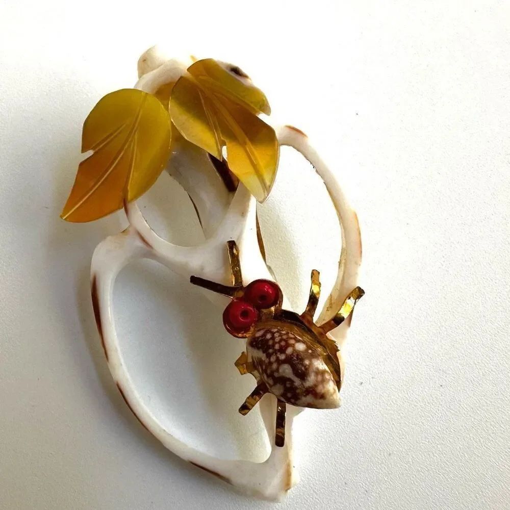 Vintage shell brooch with insect